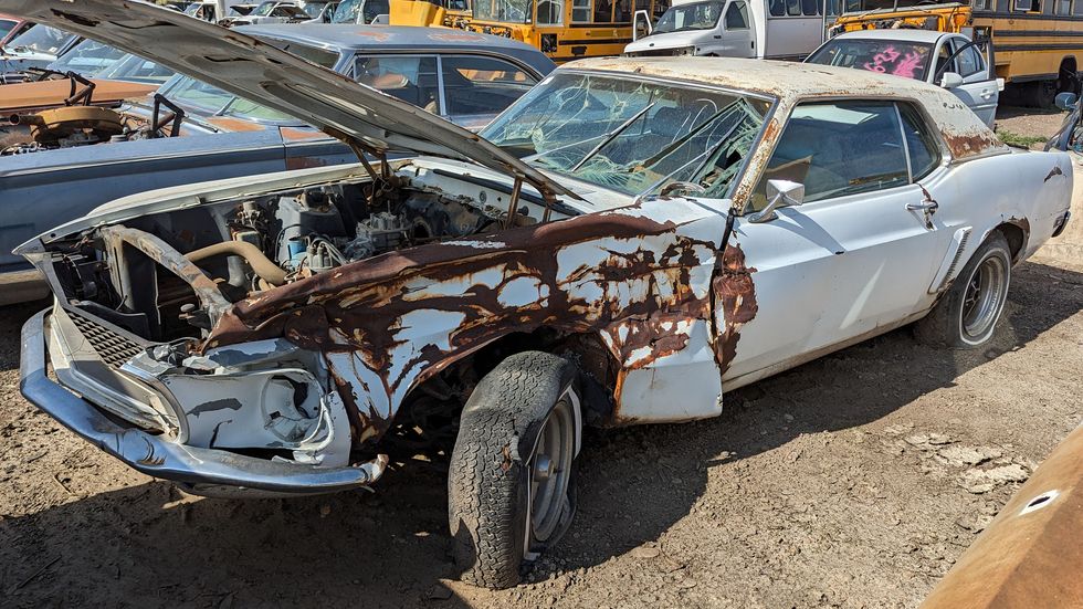 early ford mustang in colorado junkyard