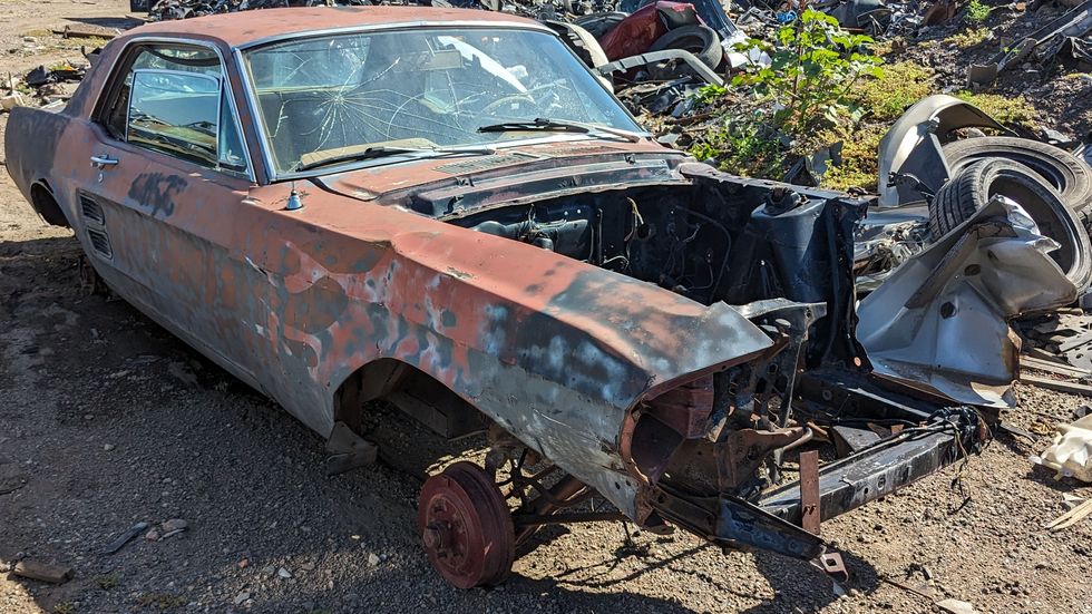 early ford mustang in colorado junkyard