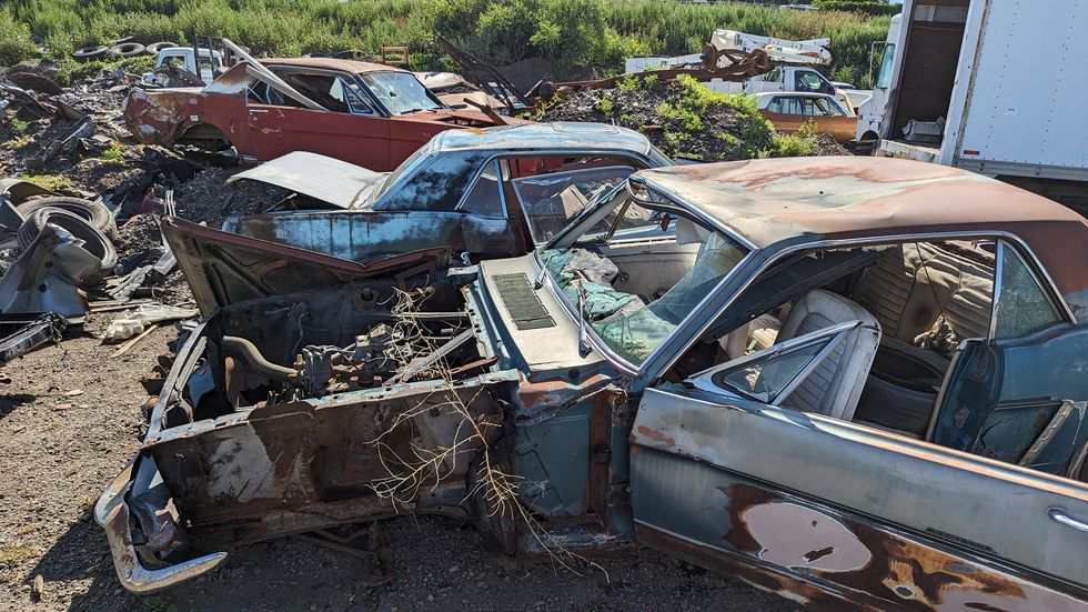 first generation ford mustangs in colorado junkyard