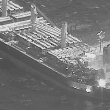 bulk carrier true confidence on fire after being hit by houthi anti ship ballistic missile