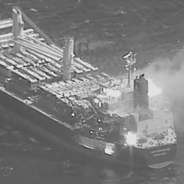 bulk carrier true confidence on fire after being hit by houthi anti ship ballistic missile