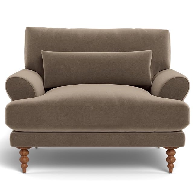 a brown couch with a cushion a brown couch with a cushion