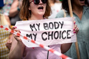 a protestor holds a placard