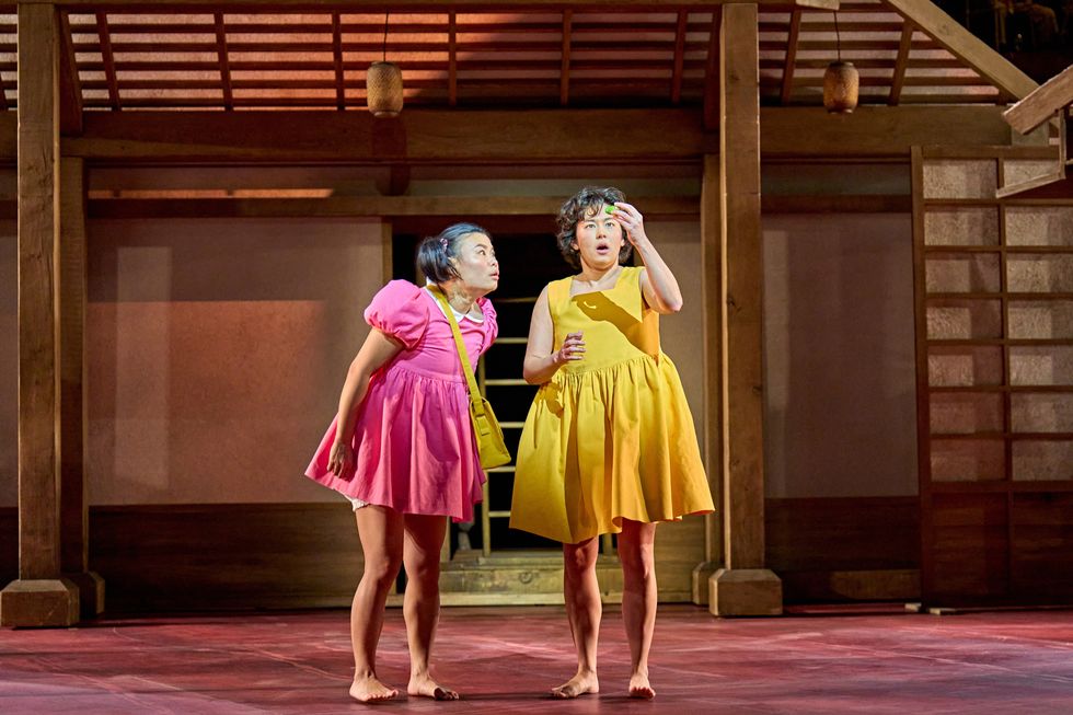 two girls in dresses on a stage
