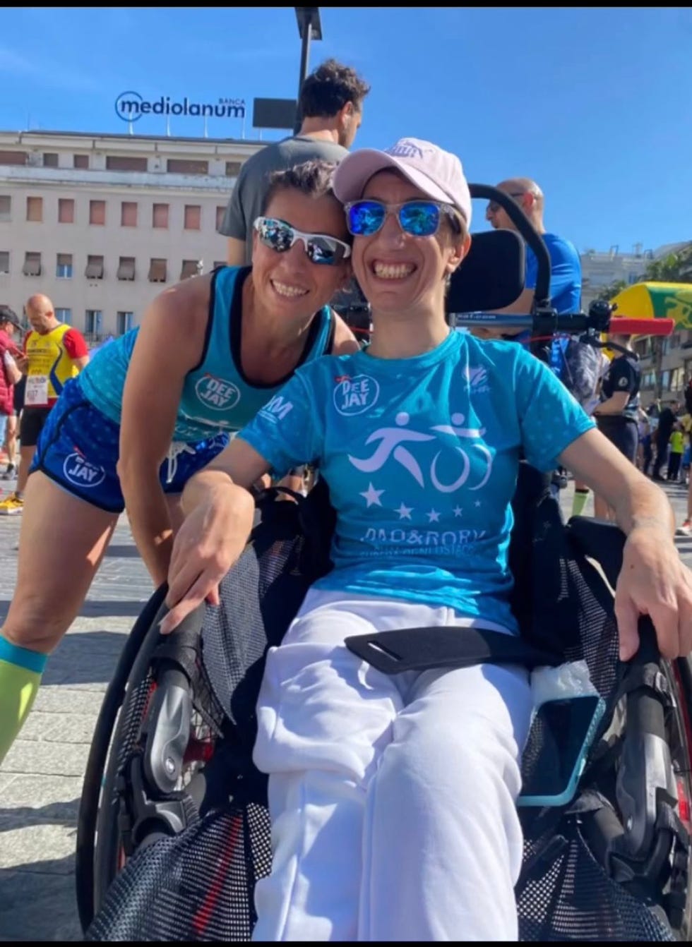 a man and woman wearing wheelchairs
