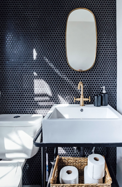 black and white bathroom with brass accents