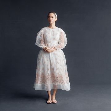 a barefoot bride in a white simone rocha tea length gown