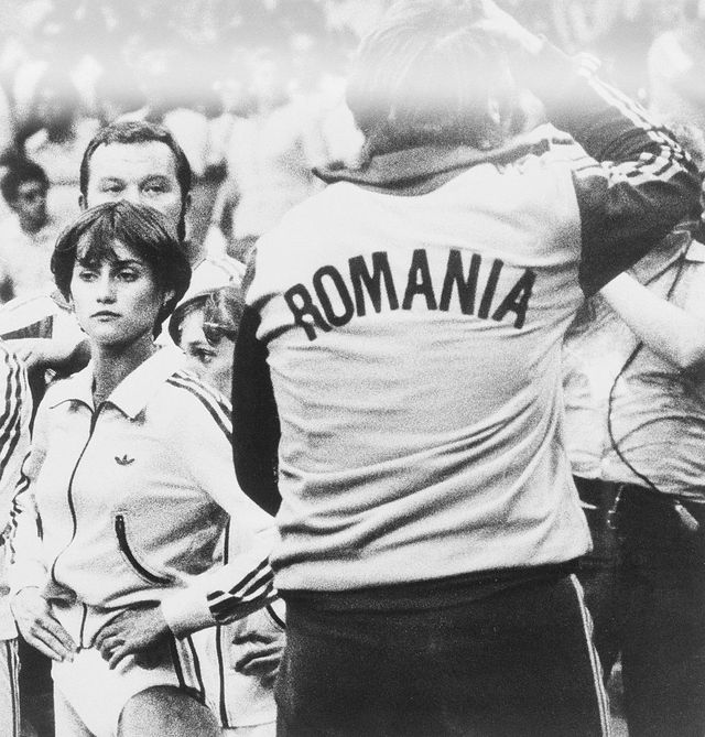 Nadia Comaneci and Coach Reacting in Disbelief