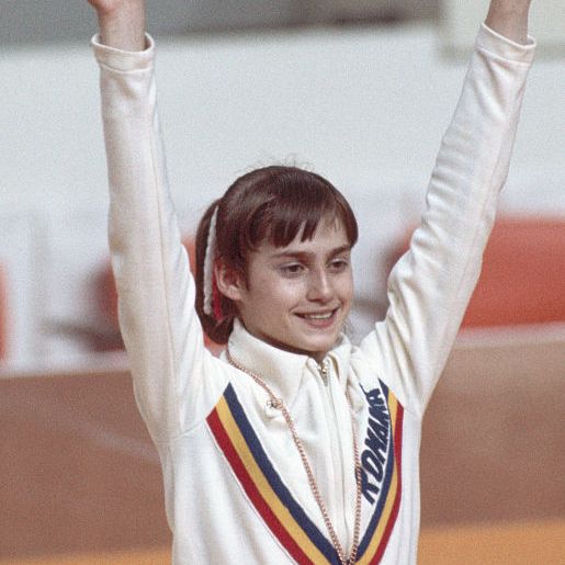 nadia comaneci celebrating her olympic victory