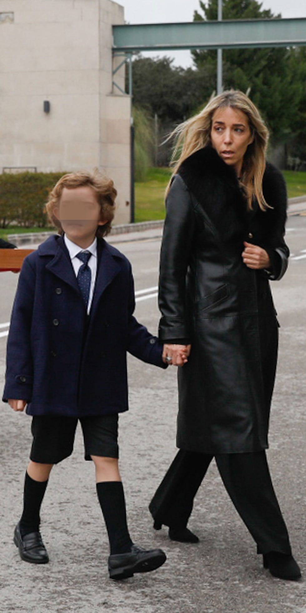 a person and a boy walking