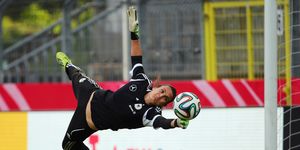 Nadine Angerer makes a save during a Germany training session at Carl-Benz-Stadion on April 9, 2014 in Mannheim, Germany