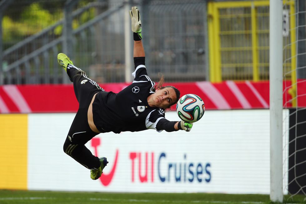 Nadine Angerer makes a save during a Germany training session at Carl-Benz-Stadion on April 9, 2014 in Mannheim, Germany