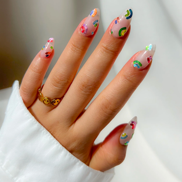 a woman's hand with painted nails