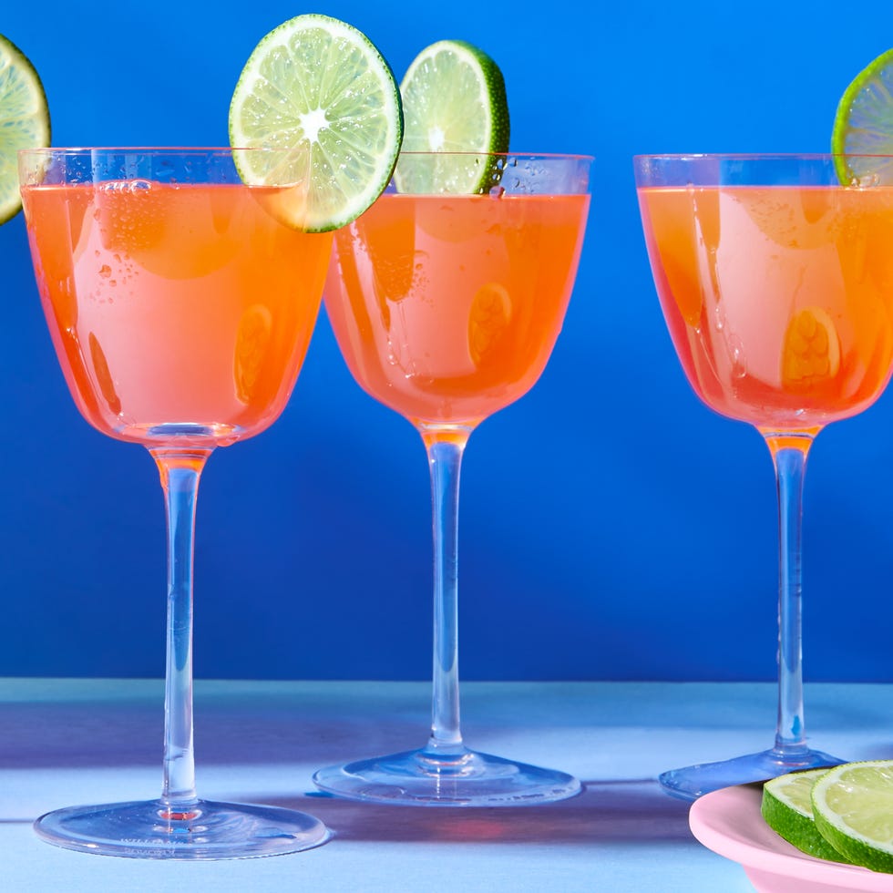 three cocktails garnished with lime slices