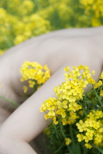 naked woman in a flower fields