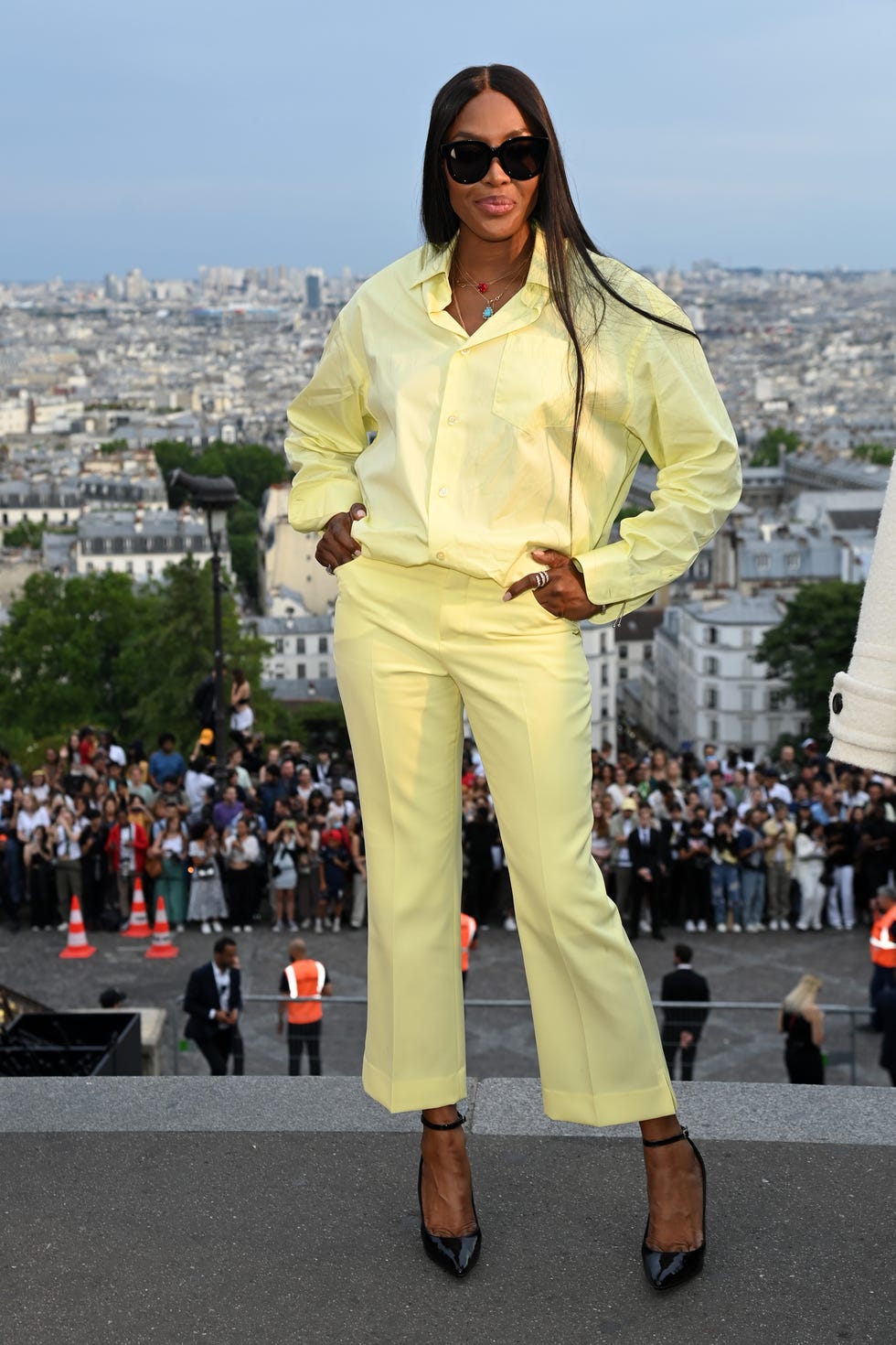 Naomi Campbell Cools Down In Undone Tropical Top for Louis Vuitton