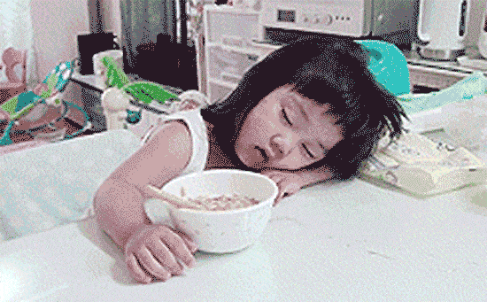 Girl eating while taking a nap