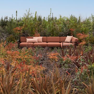 a couch in a field