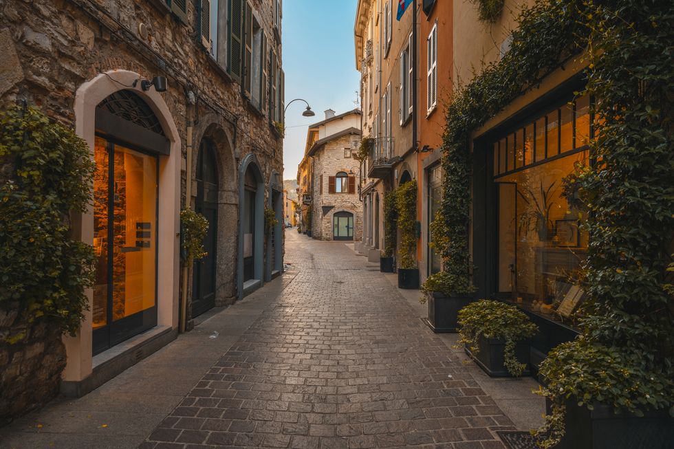 narrow alley in the old town of como, italy