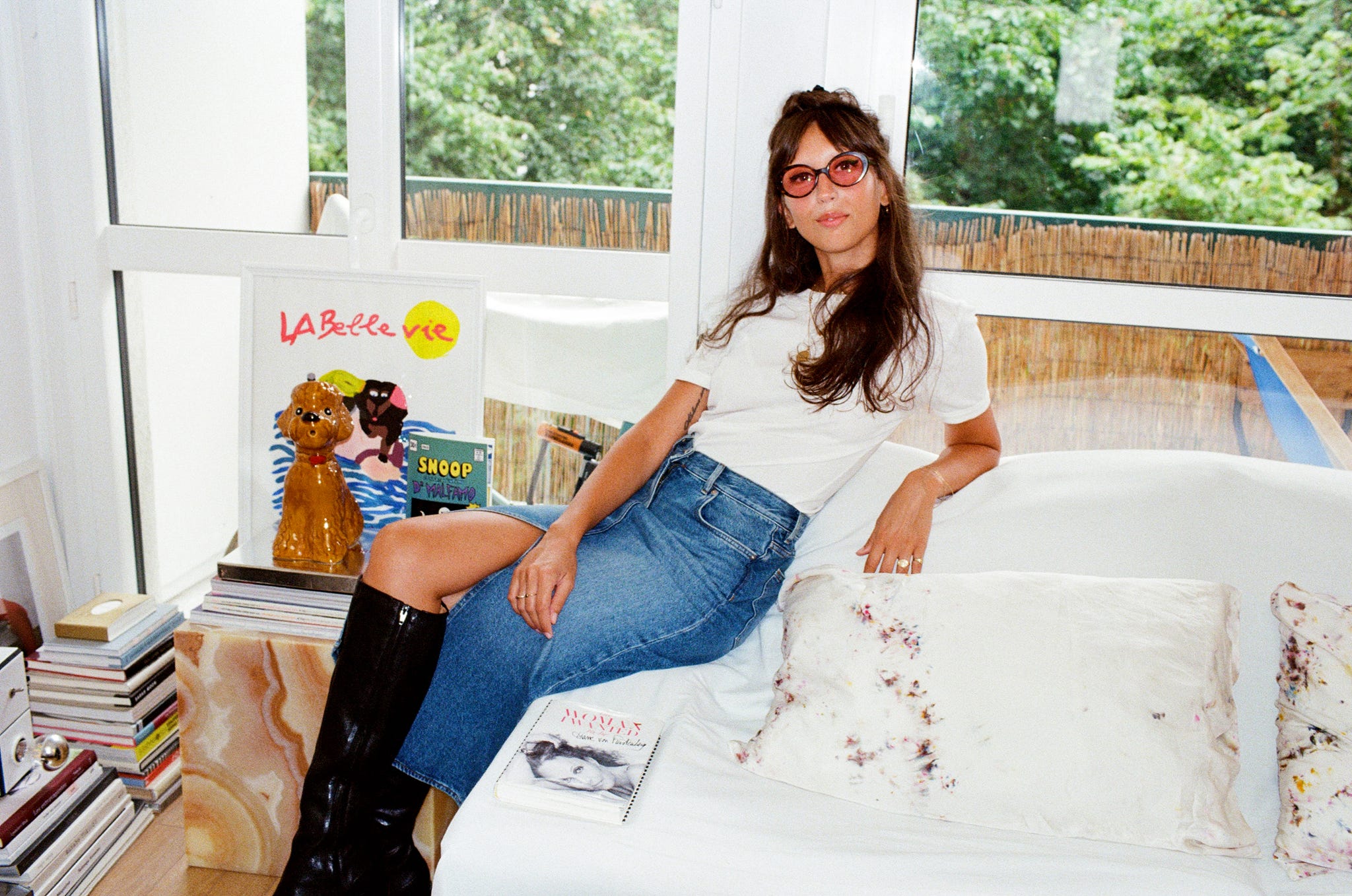 a woman sitting on a bed