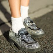 a close up shot of a person wearing sequin loafers and ankle socks in a roundup of the best socks for women 2023