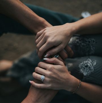 a pair of hands holding each other