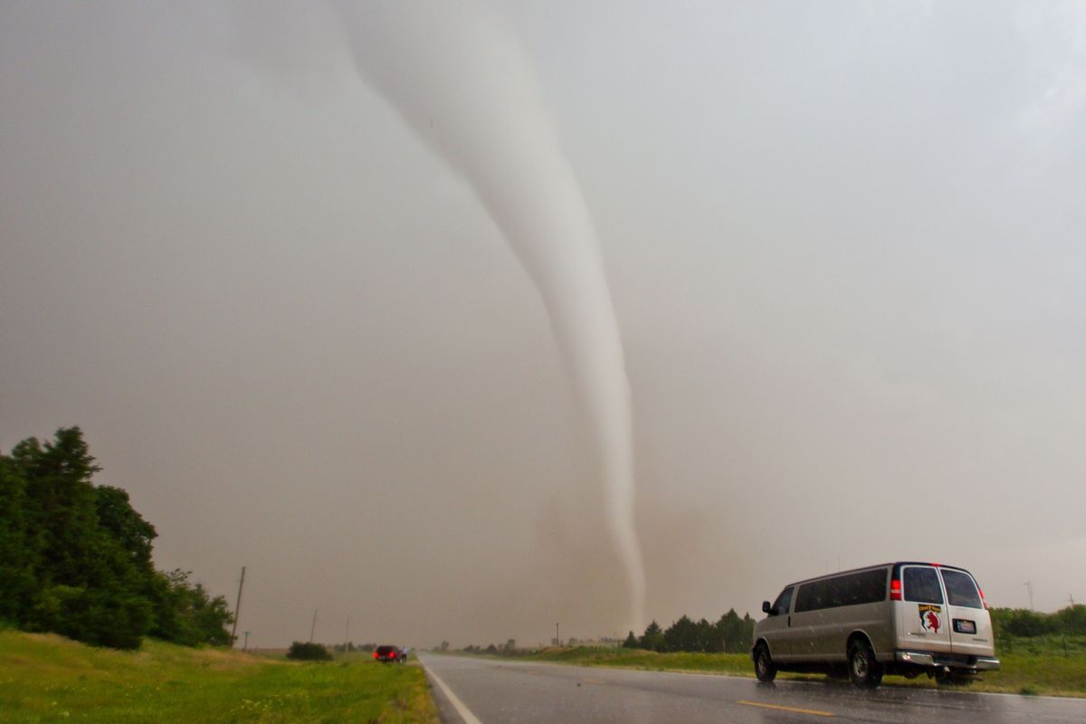 Storm chasers stop near a tornado formed under a supercell thunderstorm While scientists have a clear understanding of how climate change will influence disasters like floods and fires the influence it has on tornadoes is under investigation