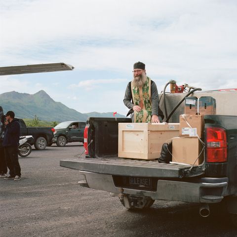 kodiak's russian orthodox priest, father innocent dresdow, helps transport anastasia's remains from the runway in old harbor to the cathedral