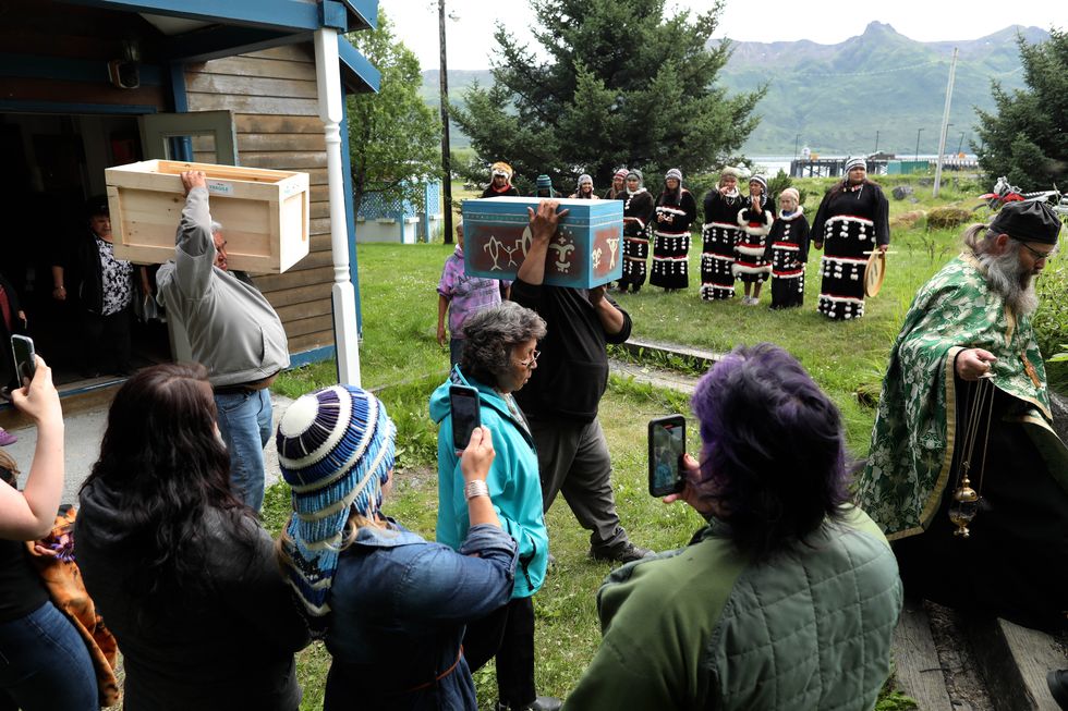 old harbor alutiiq dance group prepares to perform for anastasia in the walk up the hill to her grave