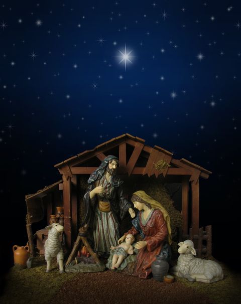 nativity scene at night with stable