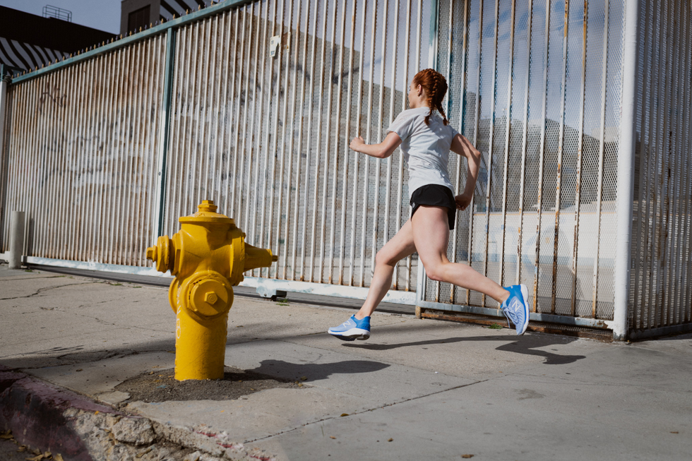 Human leg, Fire hydrant, Athletic shoe, Knee, Calf, Street fashion, Running, Pedestrian, Active shorts, Jogging, 