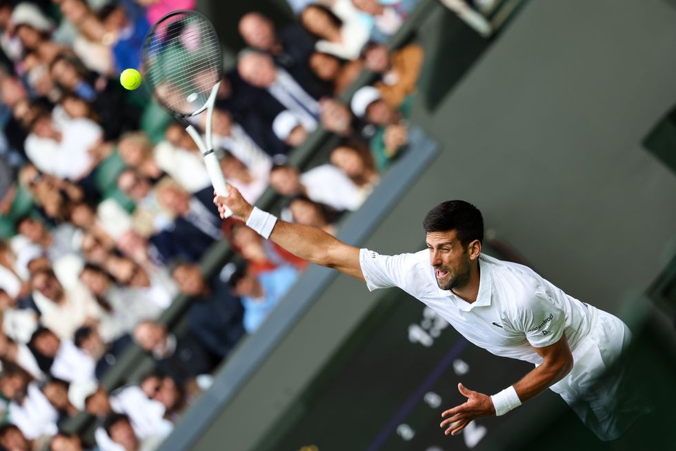 london, england july 03 novak djokovic of serbia serves in the men's singles first round match against pedro cachin of argentina during day one of the championships wimbledon 2023 at all england lawn tennis and croquet club on july 03, 2023 in london, england photo by shi tanggetty images