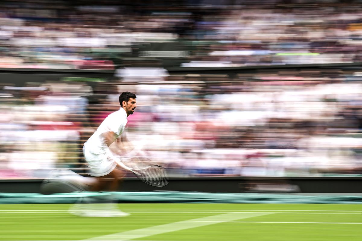 london, england july 03 novak djokovic of serbia plays a forehand in the men's singles first round match against pedro cachin of argentina during day one of the championships wimbledon 2023 at all england lawn tennis and croquet club on july 03, 2023 in london, england photo by shi tanggetty images