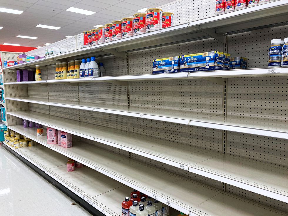 a nearly empty baby formula display shelf is seen at target