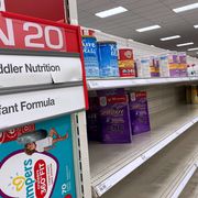 a nearly empty baby formula display shelf is seen at target