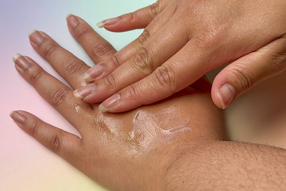 necessaire the body serum being rubbed into skin