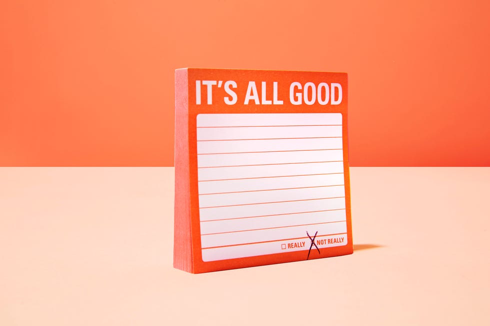 notepad with motivational prompt and checkboxes