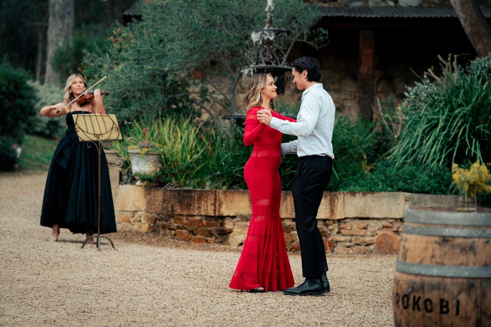 krista sinclair and leo tanaka with a violinist in neighbours
