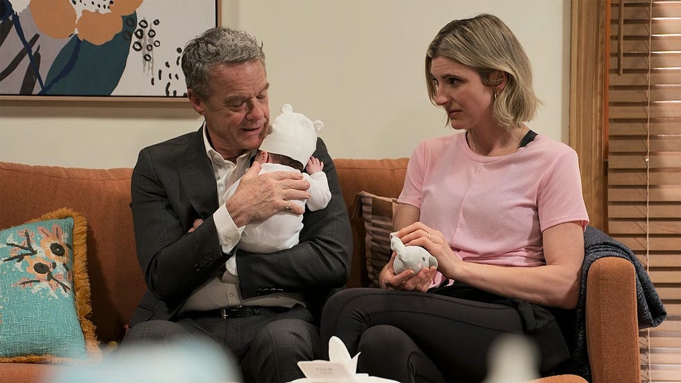 paul robinson and chelsea murphy with baby thomas in neighbours