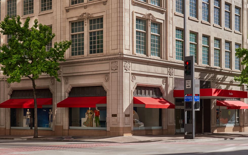 a building with red awnings