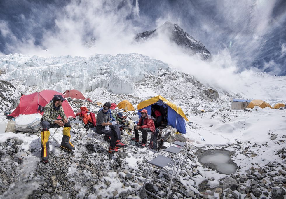 nepal, solo khumbu, everest, western cwm, mountaineers sitting in camp