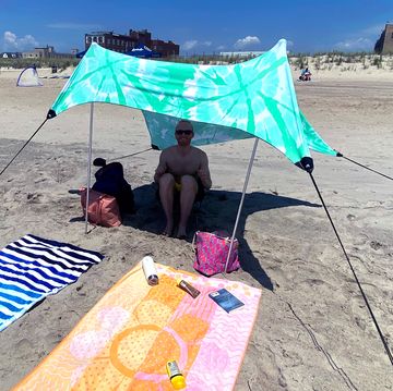 neso shade tent set up on beach with towels