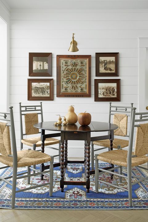 dining area with blue persian style rug and barley leg dining table