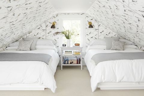 attic bedroom with bird wallpaper