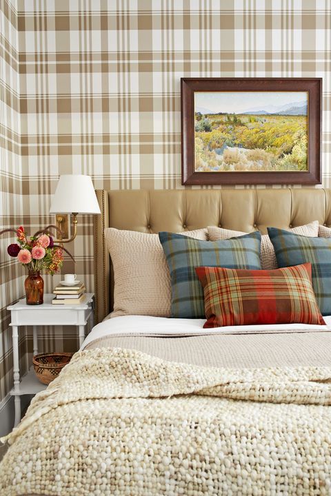 small bedroom with brown and white plaid wallpaper