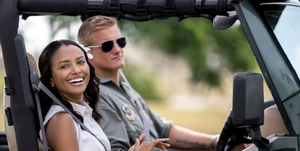 kat graham and alexander ludwig in a jeep