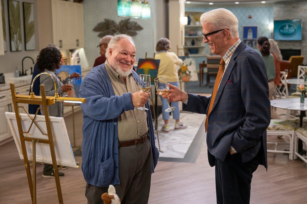 Stephen McKinley Henderson as Calbert and Ted Danson as Charles clink glasses in the Netflix sitcom 