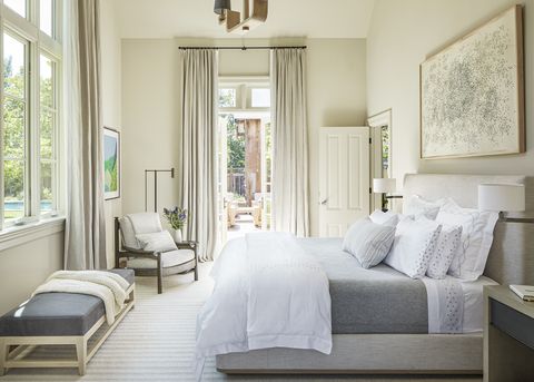 bedroom with garden, accessible through a pair of french doors 

art i’m amazed, ed ruscha 
chandelier and chair lucca antiques 
curtain fabric belgian linen
rug mitchell denburg
bed custom, in romo bedding from e braun  co