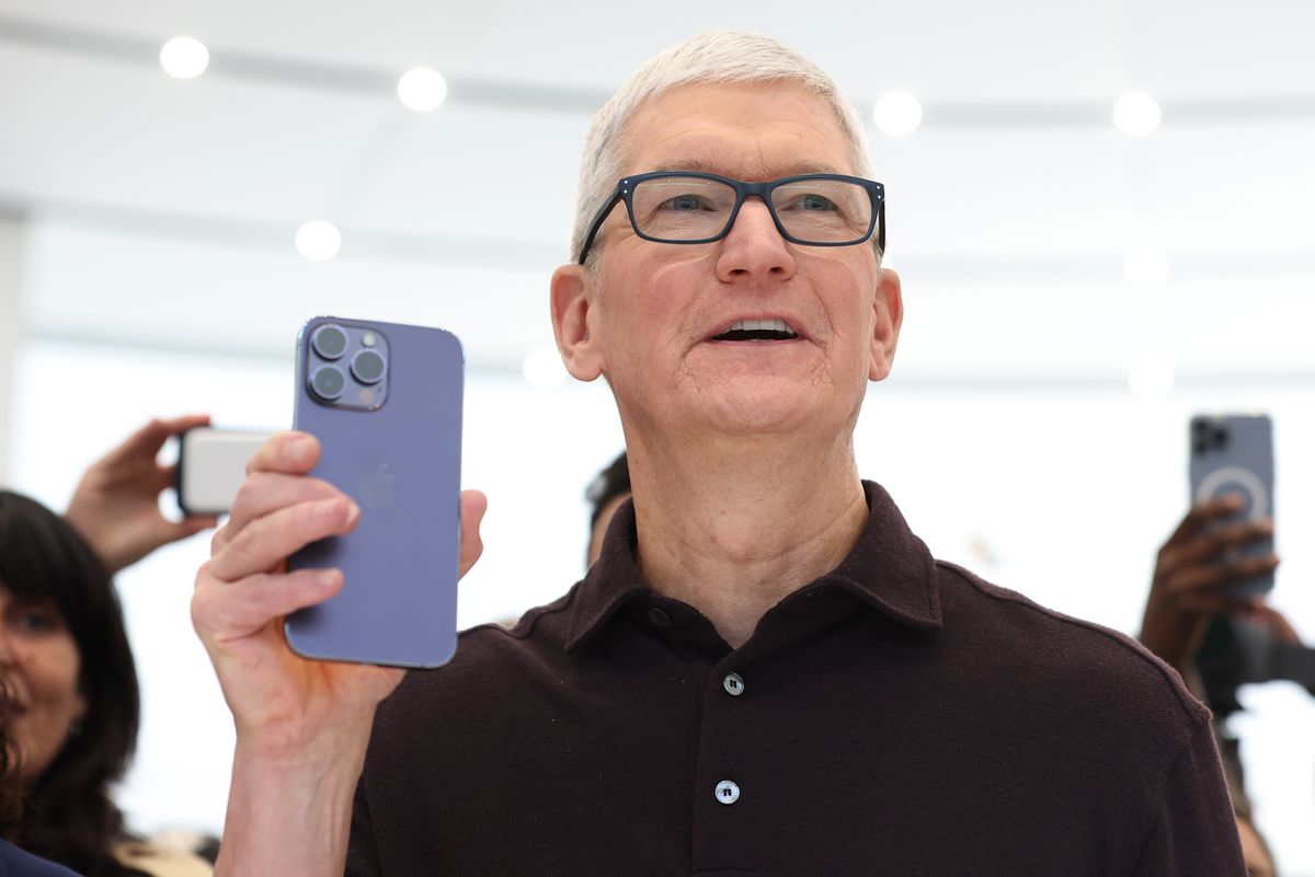 tim cooks holds apple iphone 14 pro iphone at cupertino california event