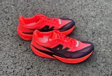 a pair of red and black running shoes